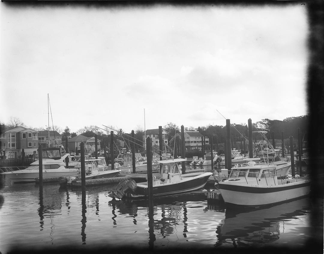 State Marina. Shot on @new55film with my Speed Graphic. I was trying to figure out why so many of my shots had this black smoke effect. The periodic nature of it suggested roller problems in my 545 holder. I also have a 545i holder, so I used it for this shot, and voila, no black smoke. #speedgraphic #largeformat #film #filmphotography #filmphotographic #filmisnotdead