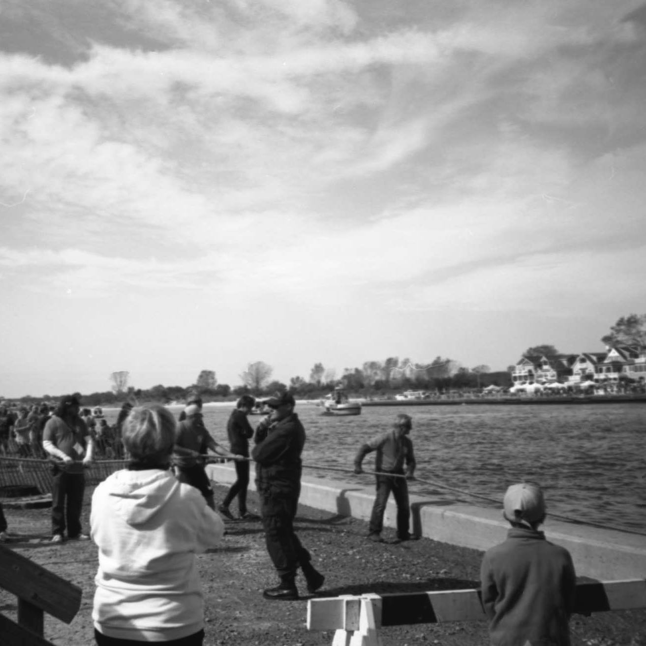 Feeding the line. 
Volunteers feed the tug-o-war line out as the boat takes it to the middle of the inlet for the Point Pleasant Beach-Manasquan cross-inlet tug-o-war a few weeks ago. Gotta keep life on the shore interesting during the off-season... #olympusxa #filmferrania #filmferraniap30 #rodinal #labbox #film #filmphotography #filmphotographic