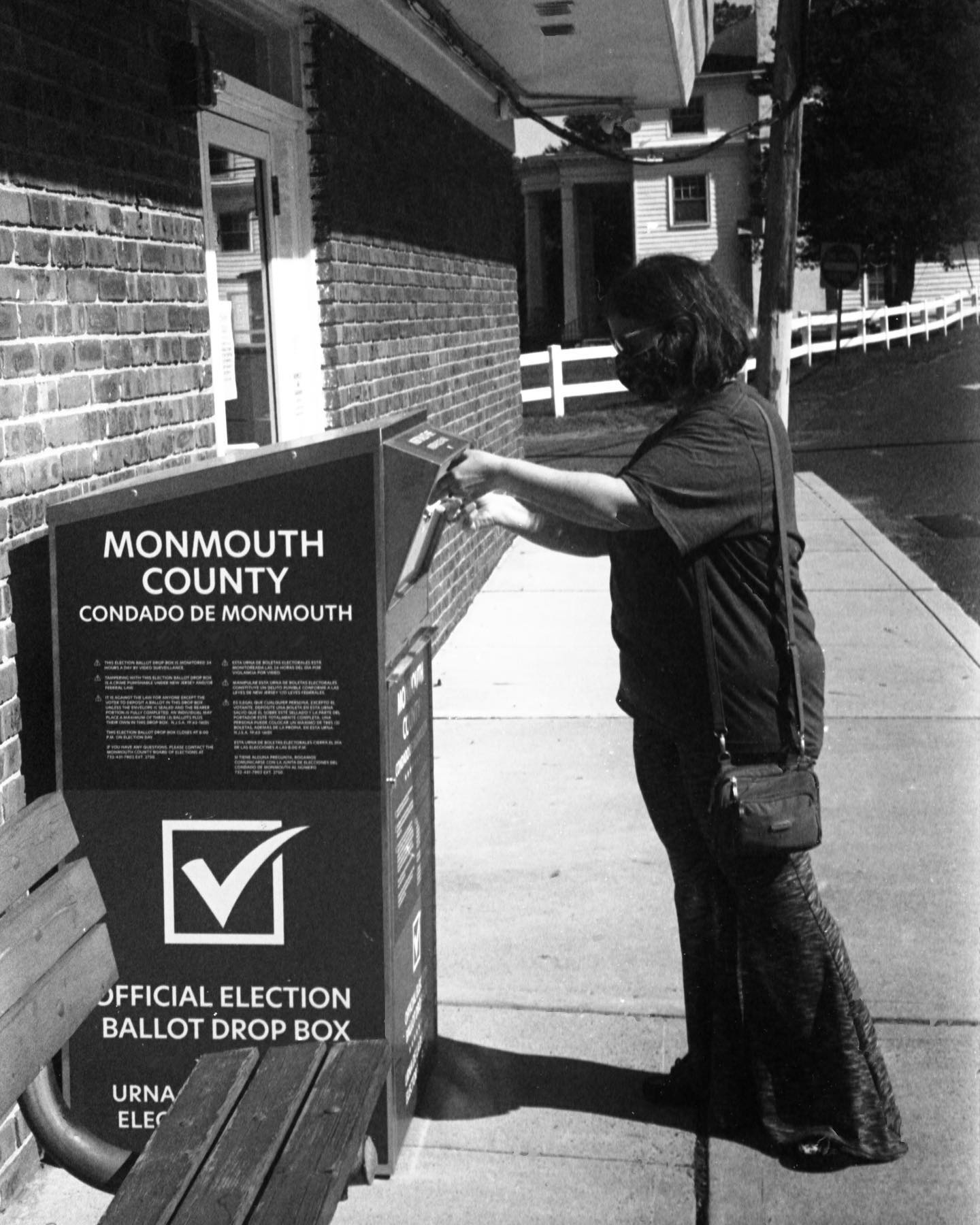 Laura voting about four weeks ago. Shot on Plus-X with my Contax III. Thanks, @govmurphy for making it so easy to vote during the pandemic. We should move to #handmarkedpaperballots for every election from here on out. #film #filmphotography #allthroughalenspodcast #election2020 #vote